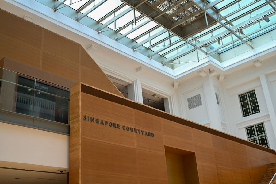 Interior courtyard with wooden walls and glass ceiling